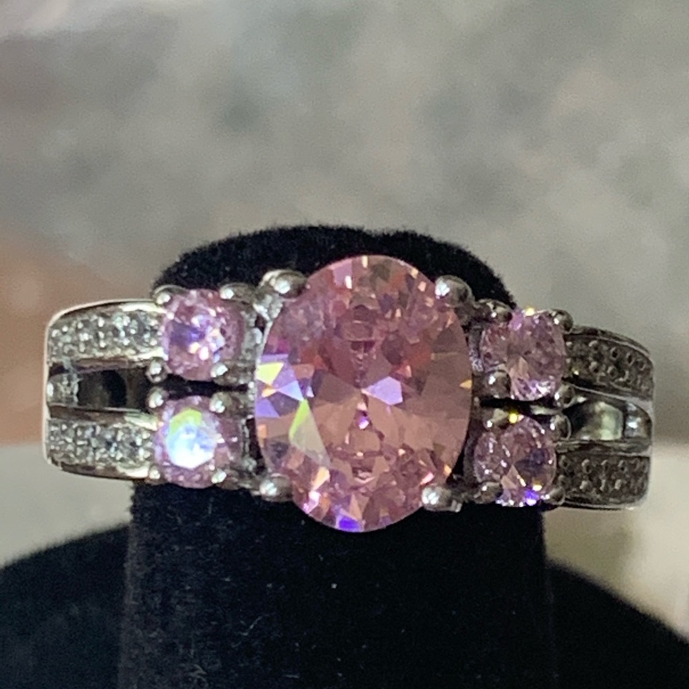 Pink oval stones along side with white CZ
